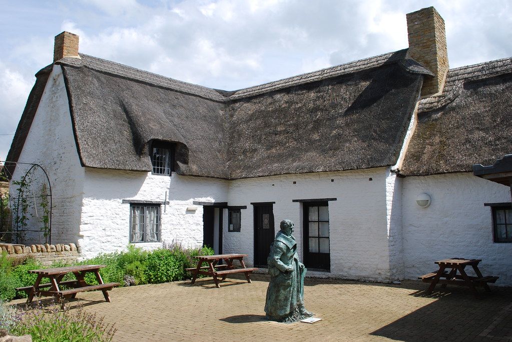 courtyard garden at john clare's cottage with statue of the peasant's poet